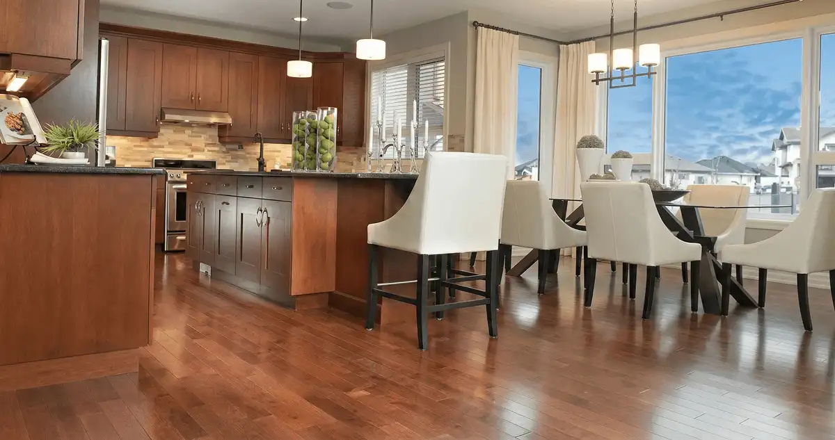 A modern kitchen with professionally installed wood flooring in Tulsa, OK