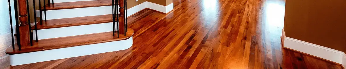 Base floor of a staircase with professionally restored wood flooring in Tulsa OK