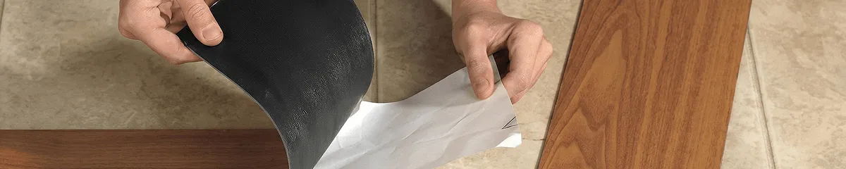 A professional installing vinyl flooring in Tulsa, OK